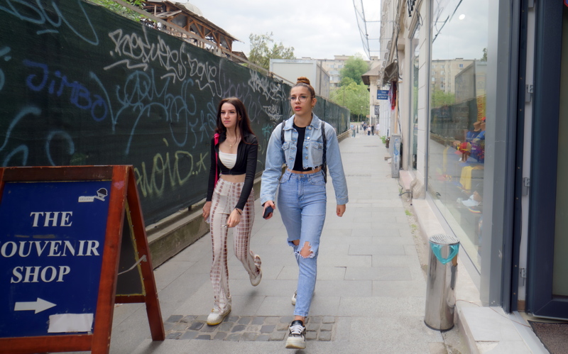 Scene capturing casual street fashion featuring trendy urban coordinates